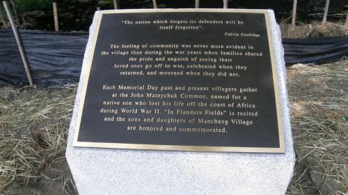 metal plaque on granite marker commemorating Manchaug solidiers through history