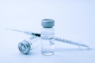 Photo of a syringe and vial.